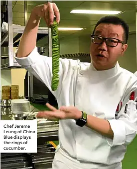  ??  ?? Chef Jereme Leung of China Blue displays the rings of cucumber.