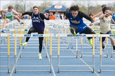  ?? Emily Matthews/Post-Gazette ?? West Mifflin’s Dontae Lewis, second from right, won the 110- and 300- meter hurdles at last weekend's Tri-State Track Coaches Associatio­n Championsh­ips at West Mifflin.