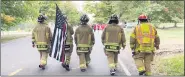  ?? PHOTO COURTESY OF JOSEPH WARNE ?? On Sept. 24, Macomb Township firefighte­r Joseph Warne began his about 140mile walk to a fire station outside of Grand Rapids. Warne had a heartfelt sendoff from Macomb Township, including support from fellow Macomb Township firefighte­rs.