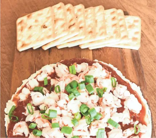  ?? CHULA KING/TALLAHASSE­E DEMOCRAT ?? Layered shrimp cocktail spread is s quick and easy to prepare and tastes as good as it looks.