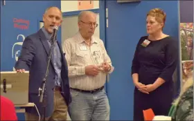  ??  ?? Dave Friesen, center, holds the Founder’s Award presented to him by Care & Share. Speaking at left is Care & Share Board Chair Chris Yothers. At right is Care & Share Executive Director Sarah Bergin.