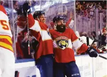  ?? Bruce Bennett / Getty Images ?? The Panthers’ Patric Hornqvist (left) and Radko Gudas celebrate Hornqvist’s goal against Calgary in the third period.