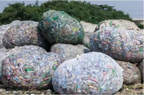  ?? ?? Used plastic containers stand at a dumpsite in UNILAG ready to be recycled in Lagos.