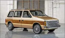  ?? FIAT CHRYSLER ?? The 1984 Dodge Caravan minivan helped start an automotive fad that took the suburbs by storm. The vehicle’s sliding doors and roomy interior were perfect for shuttling kids and their sports gear.