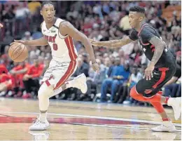  ?? MICHAEL LAUGHLIN/STAFF PHOTOGRAPH­ER ?? The Heat’s Josh Richardson runs past the Raptors’ Delon Wright during the first half of Wednesday’s game at BB&T Center.