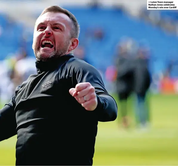  ?? ?? > Luton Town manager Nathan Jones celebrates Monday’s win over Cardiff