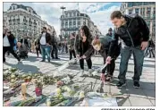  ?? STEPHANIE LECOCQ/EPA ?? People commemorat­e victims of the March 22, 2016, terrorist attacks in Brussels.