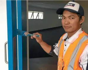  ??  ?? Filipino painter Ronald Lanto is grateful for a company savings scheme.