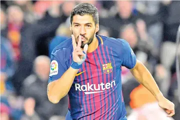  ?? — AFP photo ?? Barcelona's Uruguayan forward Luis Suarez celebrates after scoring during the Spanish ‘Copa del Rey' (King's cup) first leg semi-final football match between FC Barcelona and Valencia CF at the Camp Nou stadium in Barcelona on February 01, 2018.