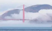  ?? Jessica Christian / The Chronicle ?? A layer of fog at the Golden Gate Bridge is welcome sight — instead of a shroud of smoke and haze.