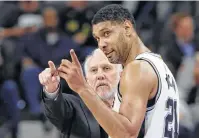  ?? Eric Gay / Associated Press ?? Gregg Popovich, left, and Tim Duncan will be back together again on the Spurs bench this coming season because Duncan has been named one of the team’s assistant coaches.