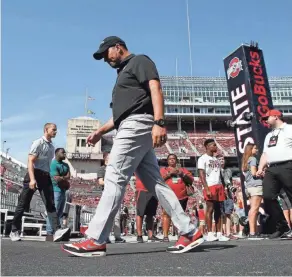  ?? ADAM CAIRNS/COLUMBUS DISPATCH ?? “You want to act and not overreact,” said Ohio State coach Ryan Day about responding to a loss.