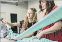  ?? Maria Alejandra Cardona Los Angeles Times ?? PAMELA HUNTER, right, developed a weighted blanket, which gave rise to Sheltered Co. She and Kate Stofira work on a piece.