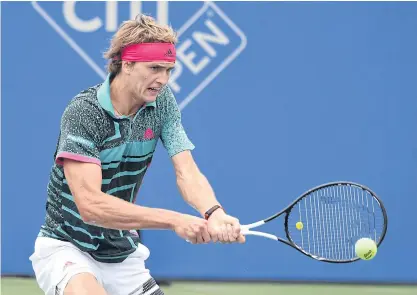  ??  ?? Alexander Zverev returns a backhand shot to Kei Nishikori.