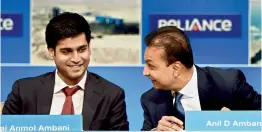  ?? — PTI ?? Chairman Reliance infrastruc­ture Anil Ambani ( right) and his son Jai Anmol Ambani during the Reliance Capital AGM in Mumbai on Tuesday.