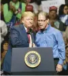  ?? CHARLES REX ARBOGAST/AP ?? President Donald Trump, left, and Republican senatorial candidate Mike Braun shake hands in 2018.