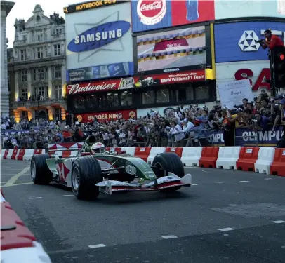  ??  ?? Strange as it seems now, the appearance of F1 cars – such as this Jaguar driven by Martin Brundle – on the streets of London in 2004 was part of a promotion for the British GP. However, it also called into question Silverston­e’s hosting of the race and increased calls for an impractica­l London GP