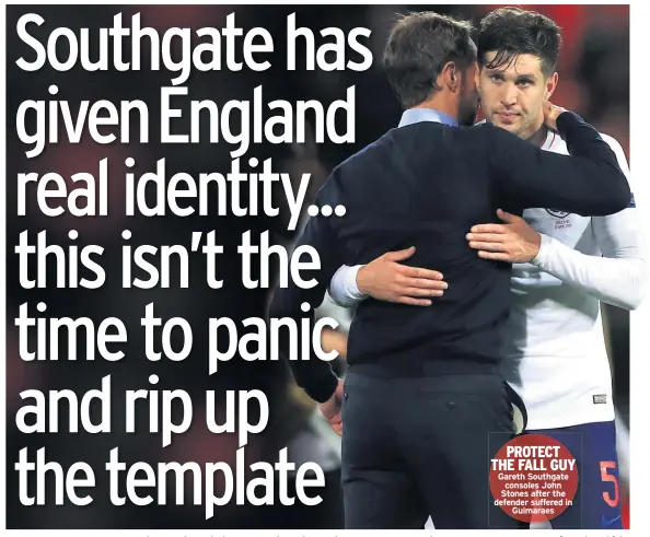  ??  ?? PROTECT THE FALL GUY Gareth Southgate consoles John Stones after the defender suffered in Guimaraes