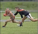  ?? ?? Arch the back: Shepparton Swans’ Andrew Riordan tries to evade Kyabram’s Tom Holman.