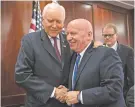  ?? J. SCOTT APPLEWHITE/THE ASSOCIATED PRESS ?? Rep. Kevin Brady, R-Texas, center, embraces Sen. Orrin Hatch, R-Utah, left, after GOP leaders announced Wednesday that they have forged an agreement on a sweeping overhaul of the nation’s tax laws.