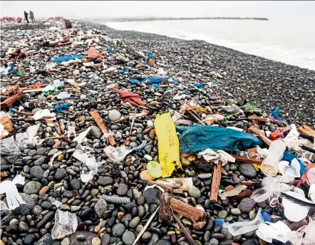  ?? — AFP ?? Plastic waste seen on a beach in Lima in June this year. Porritt says that the use of plastics for packaging will triple over the next 20 years, and a lot of that is already in our rivers, oceans and on beaches.