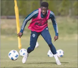  ?? The Canadian Press ?? Vancouver Whitecaps midfielder Alphonso Davies controls the ball during practice in Vancouver on Wednesday. Davies is scheduled to play his last game as a member of the Whitecaps on Sunday after signing with German club Bayern Munich earlier this year.