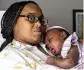  ?? MICHAEL THOMAS / AP ?? Asian Davis, 33, of Sikeston, Mo., cradles her daughter, who suffers from the effects of a brain infection, in St. Louis, on Oct. 3.