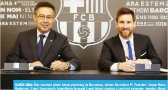  ??  ?? BARCELONA: This handout photo taken yesterday in Barcelona, shows Barcelona FC President Josep Maria Bartomeu (L)and Barcelona’s Argentinia­n forward Lionel Messi signing a contract extension keeping Messi at Barcelona until 2021. — AFP