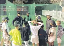  ??  ?? Cody Chetty, at the back left, who has performed well for the Hollywoods­bets Dolphins, is now coaching youngsters at the Penzance Cricket Academy.