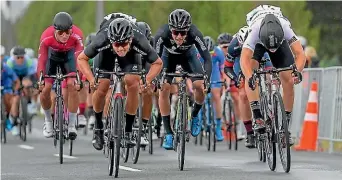  ?? DAVE LINTOTT ?? World omnium champion Campbell Stewart (in black at left) won the second stage of the New Zealand Cycle Classic in Masterton yesterday.