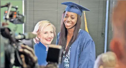  ??  ?? Is our candidates learning? Clinton with high-school graduate Dayzjohna Roberts in South Carolina in May.