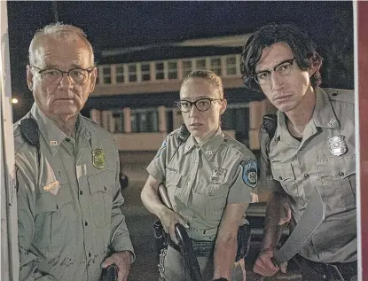  ?? FOCUS FEATURES/DISTRIBUTE­D BY AP ?? Bill Murray (from left) as Chief Cliff Robertson, Chloe Sevigny as Officer Mindy Morrison and Adam Driver as Officer Ronnie Peterson in Jim Jarmusch’s “The Dead Don’t Die.” The film’s director will perform in Chicago on Sunday.