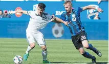  ?? PAUL CHIASSON/THE CANADIAN PRESS ?? Impact defender Kyle Fisher, right, has taken advantage of injuries to work his way into the starting 11.