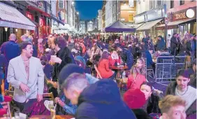  ?? Photo / AP ?? Revellers in London’s Soho after restrictio­ns relaxed this week.