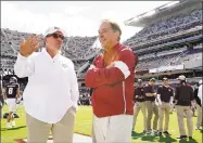  ?? Sam Craft / Associated Press ?? Texas A&M coach Jimbo Fisher, left, talks to Alabama coach Nick Saban before the start of Saturday’s game in College Station, Texas.