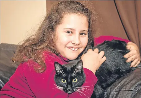  ??  ?? Natalia Rennie with her beloved cat Mittens. Picture: Gareth Jennings.