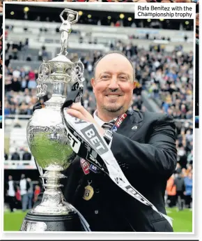  ??  ?? Rafa Benitez with the Championsh­ip trophy