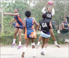  ?? (File pic) ?? Mbabane Raiders goal shooter (with the ball) in mid-air during their match against Vixens at Zakhele Netball Courts in Manzini.