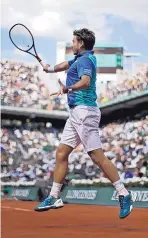  ?? PETR DAVID JOSEK/ASSOCIATED PRESS ?? Stan Wawrinka plays a shot against Gael Monfils during their fourth round match of the French Open on Monday.