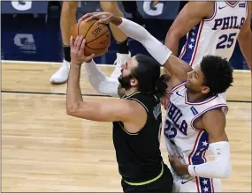  ?? JIM MONE - THE ASSOCIATED PRESS ?? Sixers guard Matisse Thybulle, right, blocks a shot by Minnesota guard Ricky Rubio from behind Friday night.