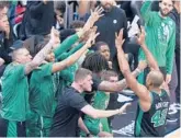  ?? WILFREDO LEE/AP ?? Al Horford (42) celebrates with teammates during the Celtics’ 93-80 win over the Heat in Game 5 of the Eastern Conference finals on Wednesday.