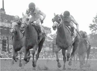  ??  ?? Creator, left, with jockey Irad Ortiz Jr., edges out Destin, with jockey Javier Castellano, to win the 148th running of the Belmont Stakes on Saturday in Elmont, New York.