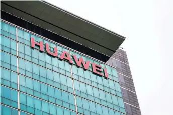  ?? Photo — Reuters file ?? A Huawei company logo is seen at the company headquarte­rs in Shenzhen, Guangdong province, China.