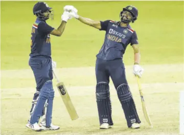  ?? (Photo: AFP) ?? India’s Deepak Chahar (right) and Bhuvneshwa­r Kumar gesture during the second One-day Internatio­nal (ODI) cricket match versus Sri Lanka at the R Premadasa Stadium in Colombo yesterday.