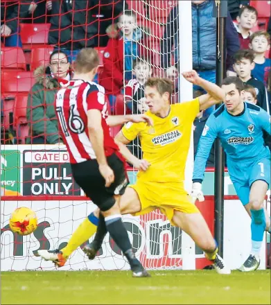  ??  ?? UNLEASHED: Sheffield United forward James Hanson fires home the second goal