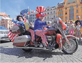  ?? MIKE DE SISTI/MILWAUKEE JOURNAL SENTINEL ?? Harley-Davidson enthusiast­s drive through Prague. The Czech Republic is a member of the European Union.