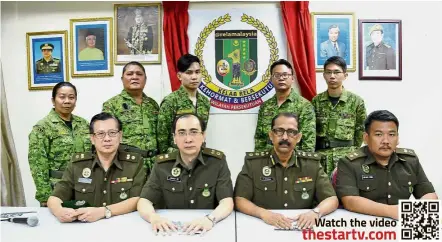  ??  ?? Taking things seriously: (Seated, from left) Rela superinten­dent P.Y. Leong, Ee, Moghan, superinten­dent Datuk Michael Wong and (standing, from left) platoon leader Chin Yit Fen, assistant deputy superinten­dent Ho Hoong Keong, Cheong, Lee and lance...