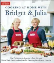  ?? DANIEL J. VAN ACKERE — AMERICA’S TEST KITCHEN VIA ASSOCIATED PRESS ?? This image provided by America’s Test Kitchen in May 2018 shows the cover for the cookbook “Cooking At Home With Bridget And Julia.” It includes a recipe for spaghetti with lemon, basil and scallops.