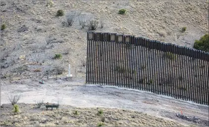  ?? ADRIANA ZEHBRAUSKA­S / THE NEW YORK TIMES ?? An portion of new border wall abruptly ends within the Coronado National Monument in Arizona. In the closing days of the Trump administra­tion, the rush was on to build pieces of Donald Trump’s much-ballyhooed border wall, even if it went unfinished and took place in remote parts of Arizona where crossings in recent years have been relatively uncommon.