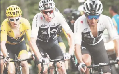  ??  ?? Team Sky riders Geraint Thomas of Britain, wearing the overall leader’s yellow jersey, Chris Froome of Britain and Egan Arley Bernal of Colombia in action yesterday. REUTERS/Benoit Tessier.